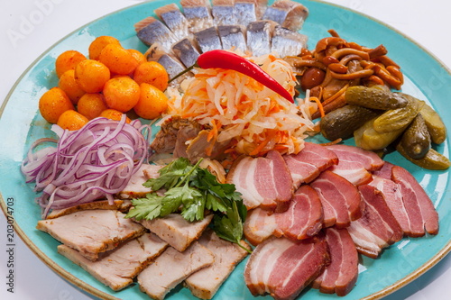 Plate with snacks for beer and herring photo