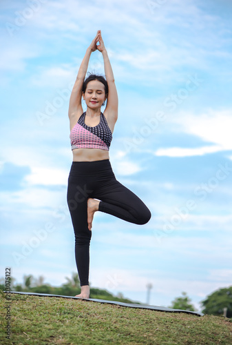 Exercise with yoga for health and relaxation,Asian woman.