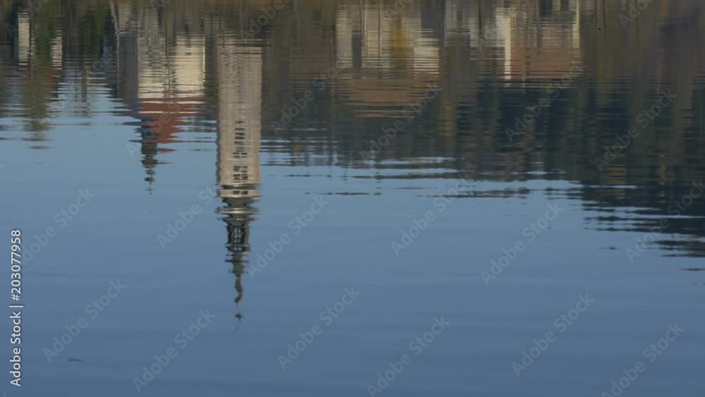 Church tower reflected in a lake Church tower reflected in a lake