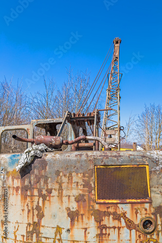 Wrack eines alten verschrotteten Baggers  photo