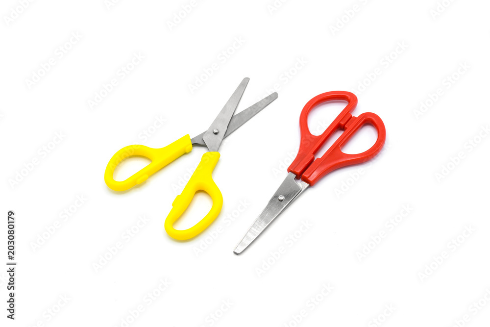 yellow and red plastic scissors isolated on white background yellow and red plastic scissors isolated on white background