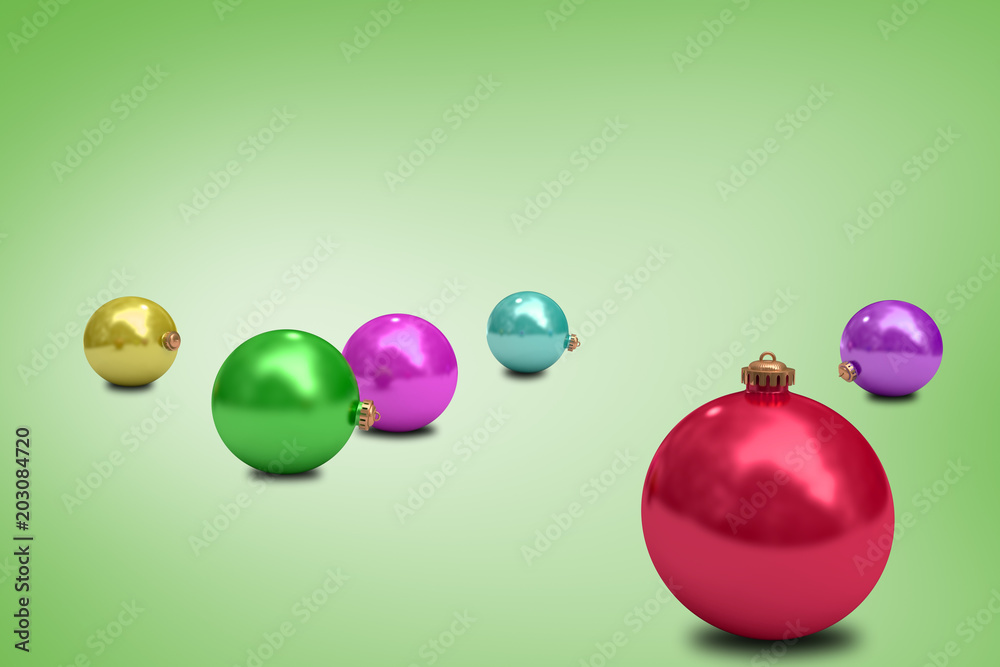 Digitally generated colourful christmas baubles against green vignette Digitally generated colourful christmas baubles against green vignette