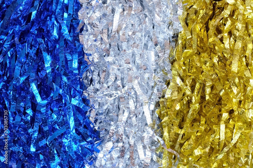 Close up blue, silver and gold pompoms use for abstract background