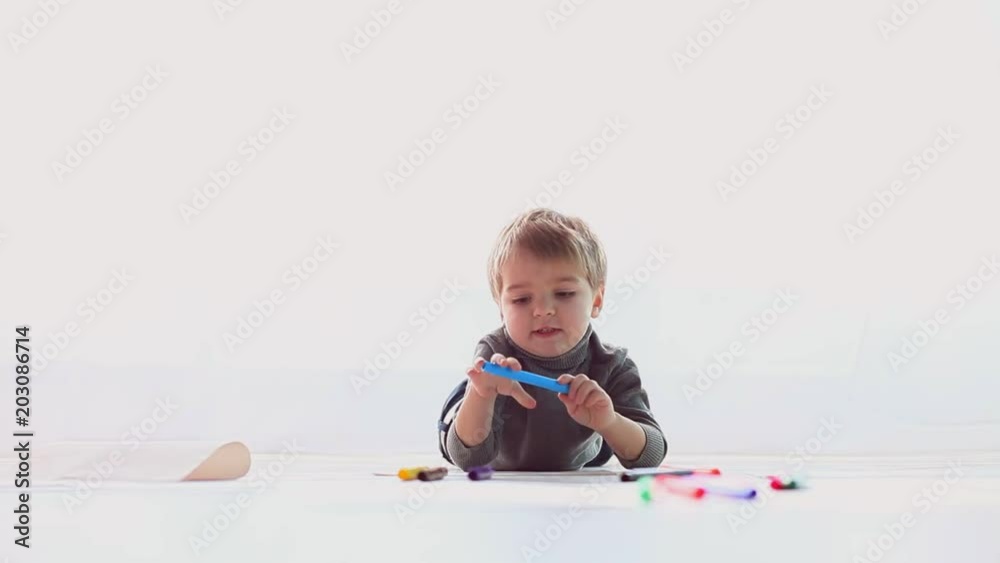 little boy draws colored pencils on paper little boy draws colored pencils on paper