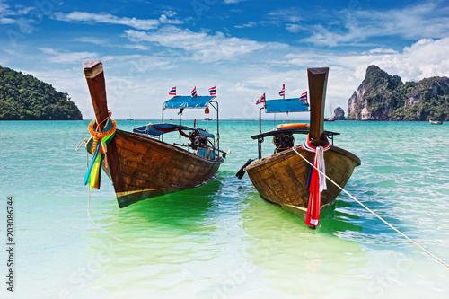Traditional longtail boats in the famous Maya bay of Phi-phi Leh island, Thailand © arbalest