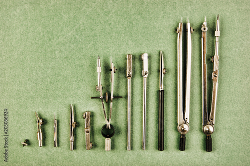 Old drawing tools on a green background