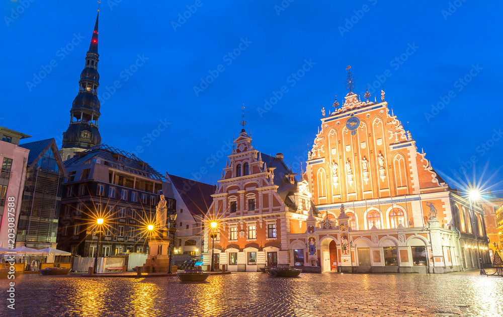 City Hall Square with House of the Blackheads and Saint Peter church in Old Town of Riga at night, Latvia