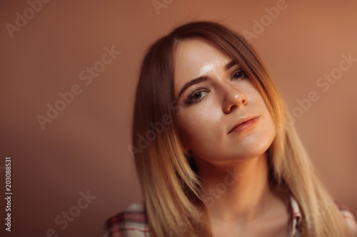portrait smiling girl on orange background in studio