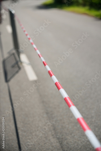 Caution area, marked by barrier tape along a street race