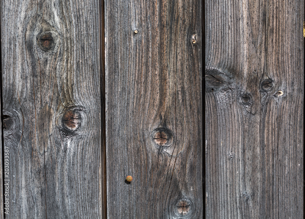 Old gray wood texture with natural patterns Old gray wood texture with natural patterns