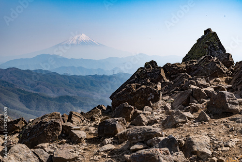 Spring Mt. Fuji rises from a mountain range and Daibosatsu-peak