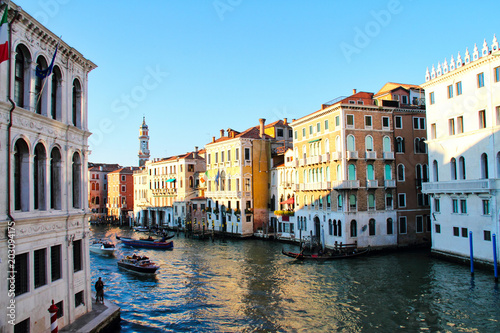 Boats along the Grand Canal of Venice in the evening.