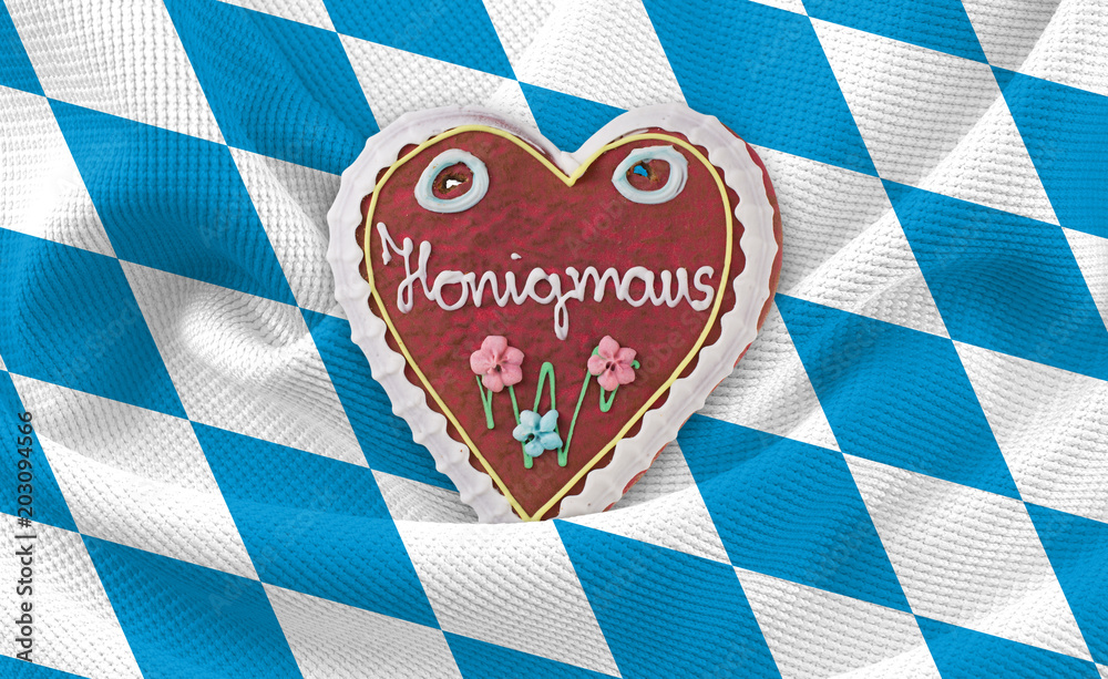 Obraz premium Oktoberfest Lebkuchenherz Honigmaus auf bayrisches Rautenmuster Tischdecke Flagge Hintergrund