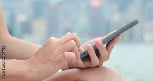 Photography Woman working on smart phone at outdoor