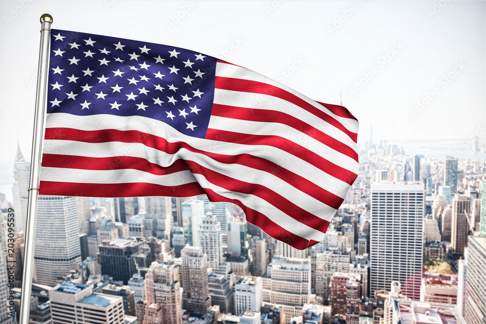 Close up of the us flag against new york skyline