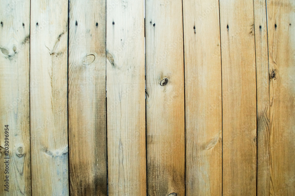 Fototapeta premium A fence made of unpainted boards