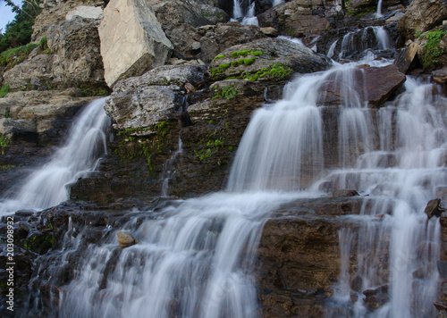 waterfall with rocks at glacier national park
