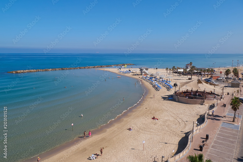 Beach with tourists. Mediterranean Sea, Netanya, Israel