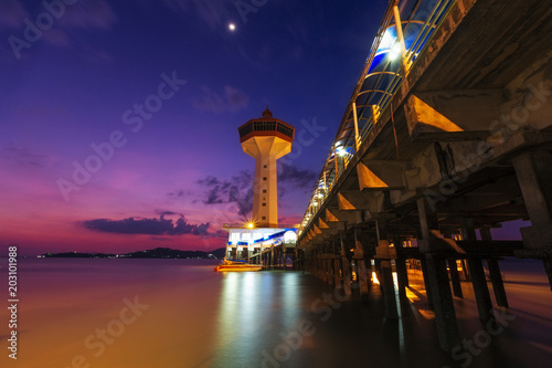 seascape. Long exposure. Lighthouse on the tropical beach and sea with sunset blue hour time in Ranong, Thailand opposite Kawthaung is in the southernmost of Myanmar in Taninth photo