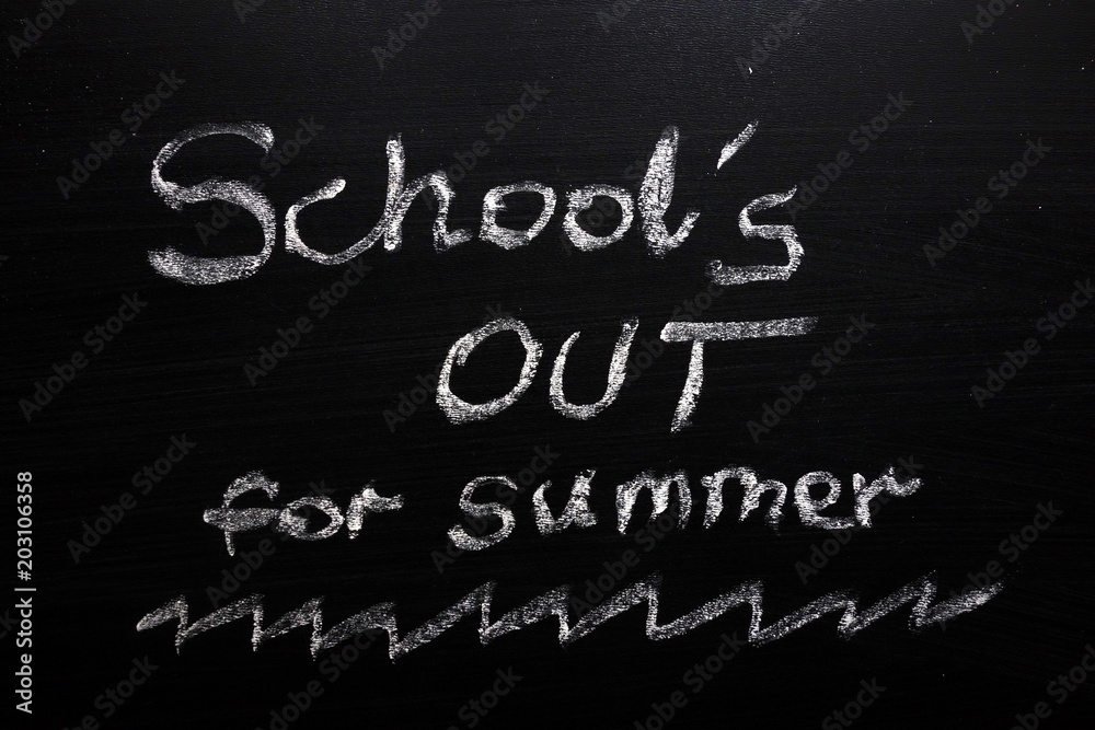 Fototapeta premium School`s out for summer text on chalkboard