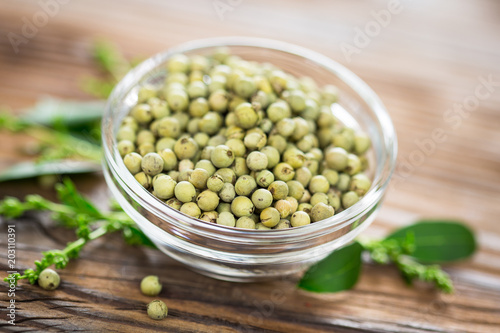 Fresh green peppercorns in the bowl