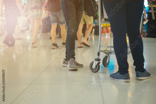 travel background woman push cart in shopping mall. image for people, luxury, crowd, body, urban concept