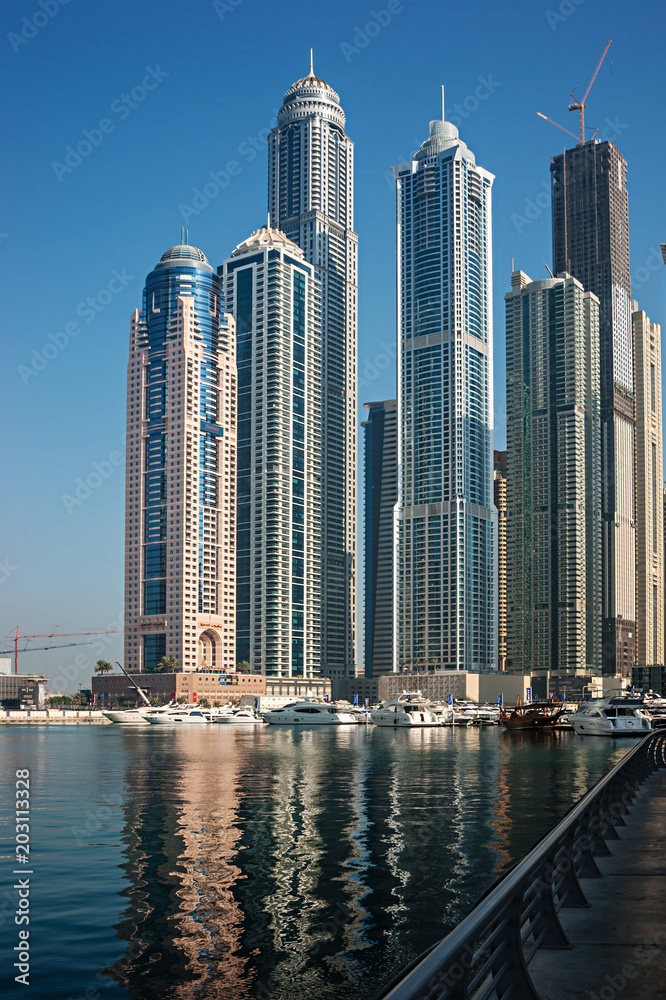 Fototapeta premium Modern city on the bay in the morning mist