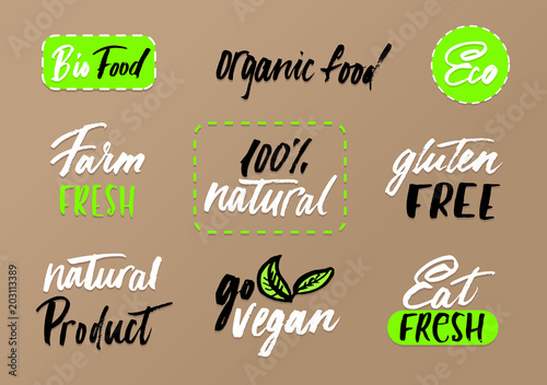 Eco labels set on craft background. Modern brush lettering eco food tags. Vegan, farm fresh, organic food, bio food,eat fresh, go vegan, natural product, gluten free. Healthy food tags for packaging.