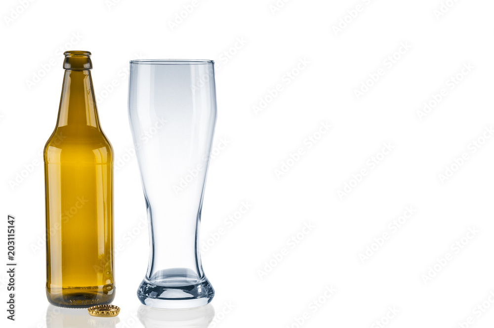Empty beer bottle and tumbler on white background Empty beer bottle and tumbler on white background