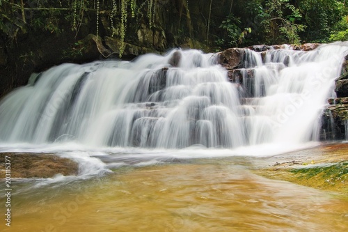 The beauty of the lush mountain stream waterfall © badins