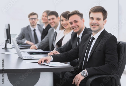 project Manager and professional business team sitting at Desk