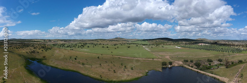 aerial view over the agricultural fields with a lake in Alentejo Portugal