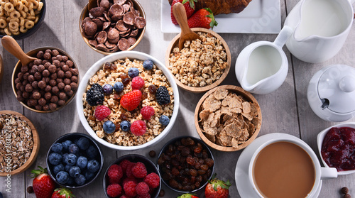 Different sorts of breakfast cereal products and fresh fruits