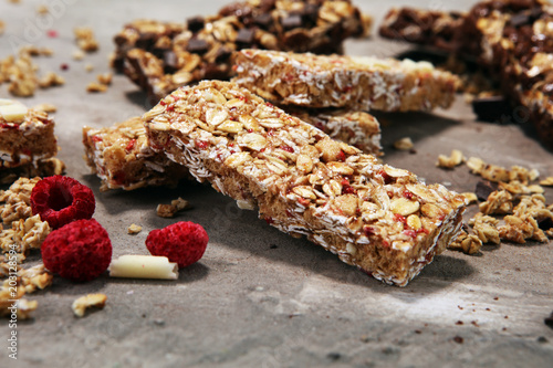 Granola bar. Healthy sweet dessert snack. Cereal granola bar with nuts, fruit and berries