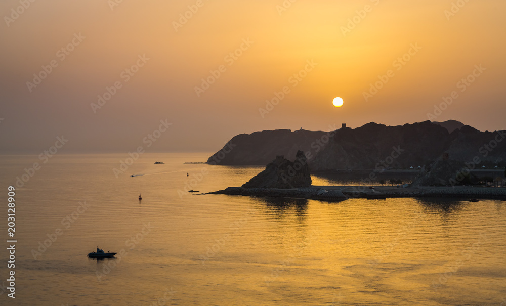 Sunrise in Muscat view from a Ship. Lovely exposure of the city of Muscat at Sunrise, view from a Ship.