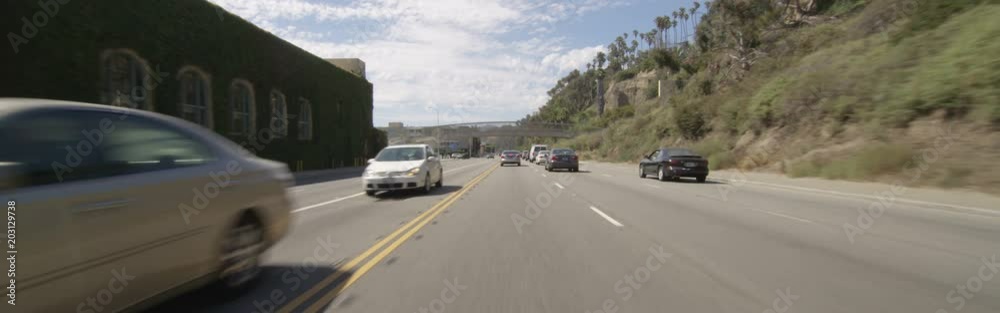 Front view of a Driving Plate: Car travels on Highway 1 from California Incline to Beach House Way in Santa Monica, California. Front view of a Driving Plate: Car travels on Highway 1 from California Incline to Beach House Way in Santa Monica, California.