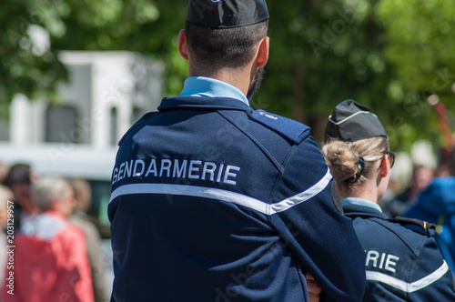 Brisach - France - 1 May 2018 - french gendarmerie patrol in lily of the valley party in the street photo