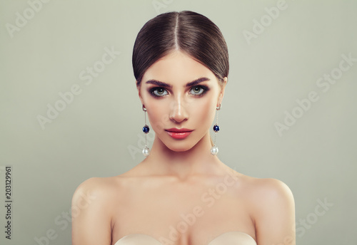 Perfect Young Woman with Jewelry Silver Earrings with White and Blue Pearls on Banner Background