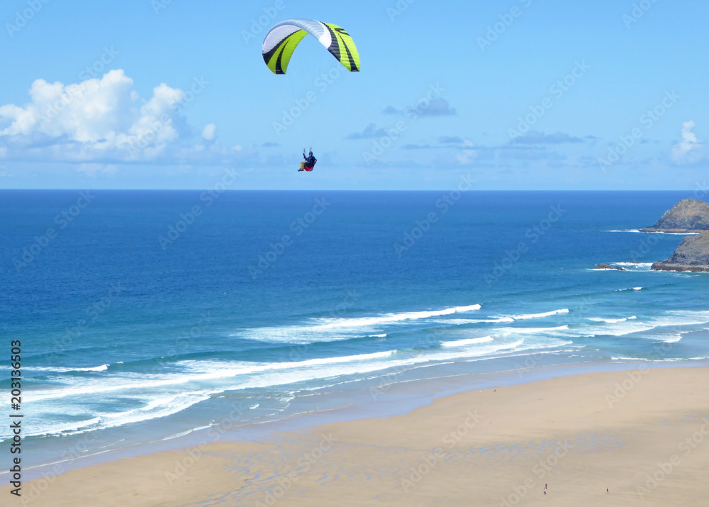 Paraglider above Perranporth Beach Paraglider above Perranporth Beach