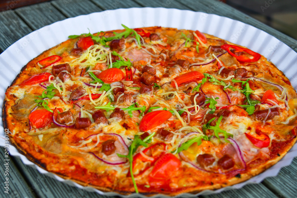  juicy tasty pizza with cheese and hunting sausages
