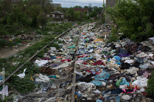 pollution concept with garbage in railroad lane in third world country