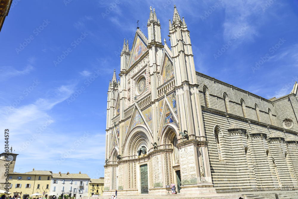 Facade of the Cathedral of Orvieto (Duomo di Orvieto) Italy. Construction in Gothic style dedicated to the Virgin Mary