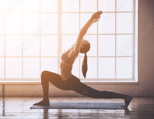 Fototapeta Naklejka Na Ścianę i Meble -  Young woman doing yoga