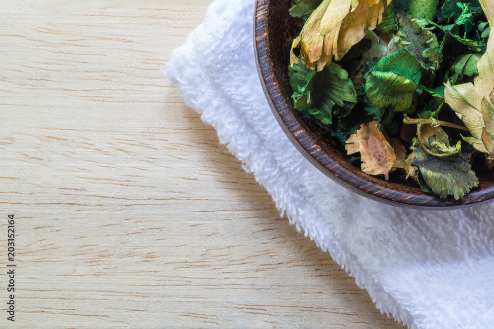 Dried flowers in a bowl on table