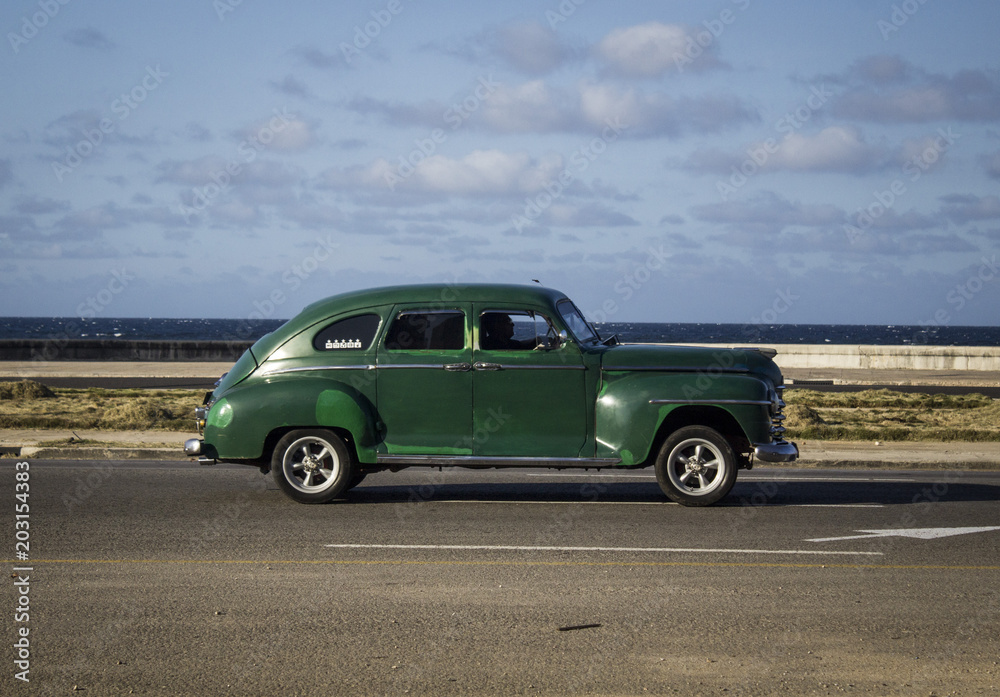 old vintage American car walking through the streets of Havana, Cuba
