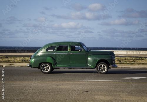 old vintage American car walking through the streets of Havana, Cuba © tyto08
