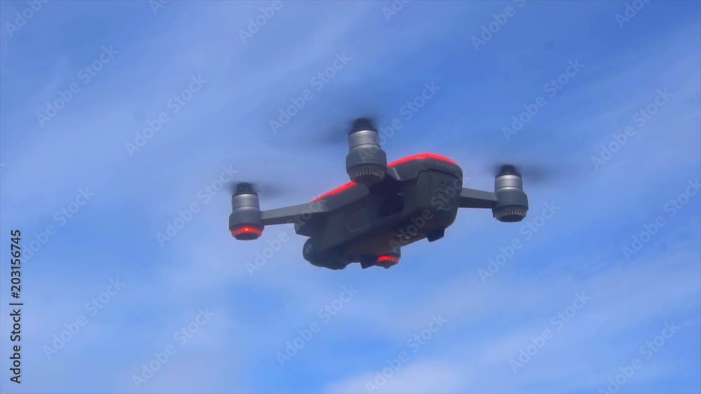 RC quadcopter hovers in the air, slow motion. RC quadcopter hovers in the air, slow motion.