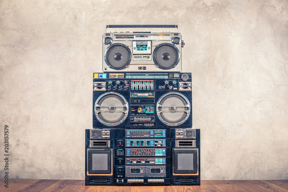Retro design ghetto blaster stereo radio cassette tape recorders boombox  tower from circa 80s front concrete wall background. Vintage instagram old  style filtered photo foto de Stock | Adobe Stock