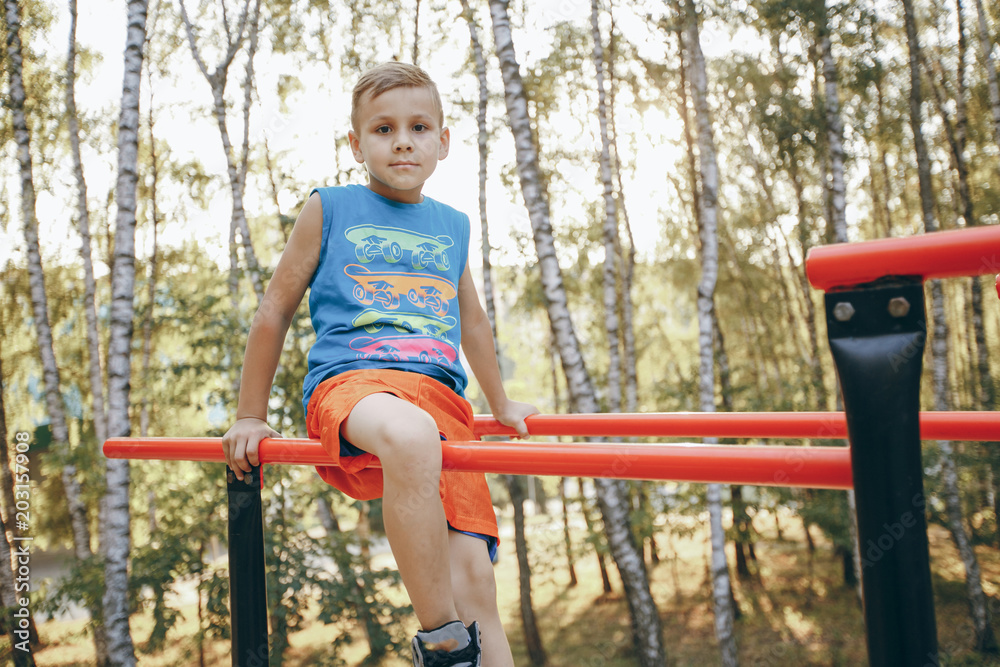 Fototapeta premium boy exercising in park