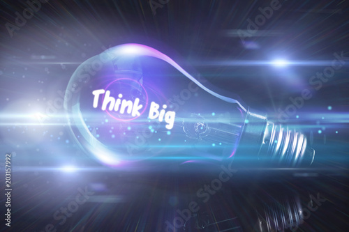 think big against glowing light bulb